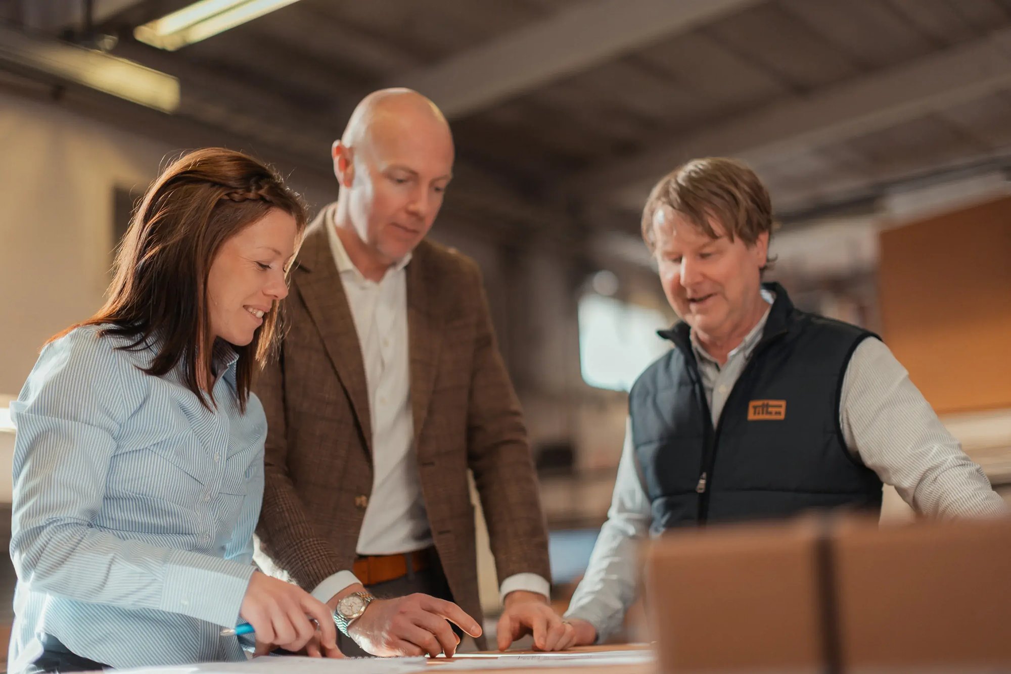 tilka-three-happy-people-working-toghether (2)